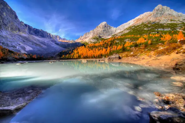 Turquoise Sorapis Lake near Cortina d'Ampezzo, with Dolomite Mountains and Forest - Sorapis Circuit, Dolomites, Italy, Europe, autumn picture.