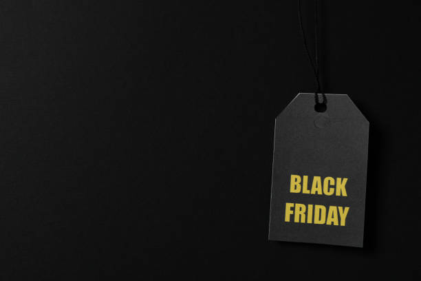 istock Inscription Black Friday on price tag on black background, copy space 1184401612
