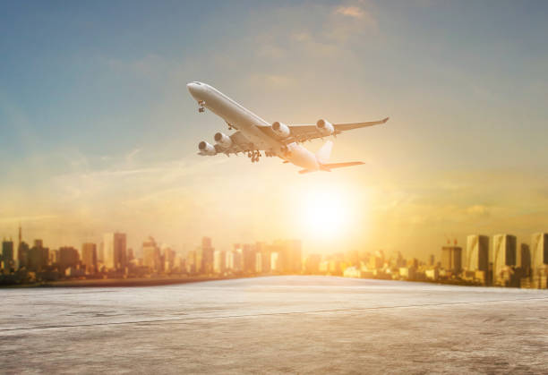 istock jet plane flying over runways and beautiful dusky sky with copy space use for air transport ,journey and traveling industry business 1184403025