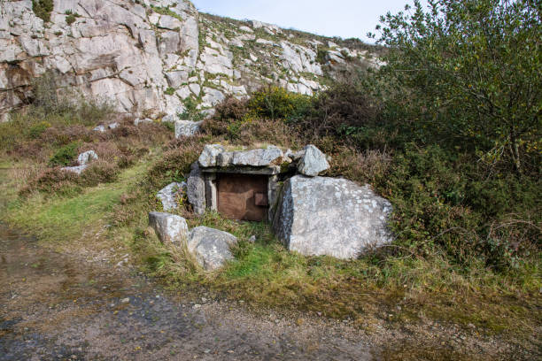 istock A small locked door to tunnels beneath an abandoned quarry 1184404499