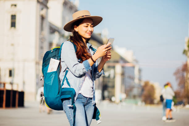 istock Beautiful Asian tourist using phone while sightseeing 1184405503