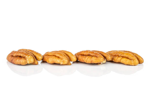 istock Dry brown pecan nut isolated on white 1184406853