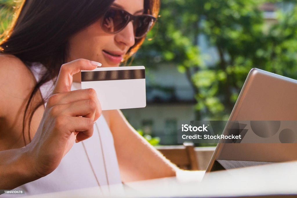 Young woman Paying online with credi card Adult Stock Photo