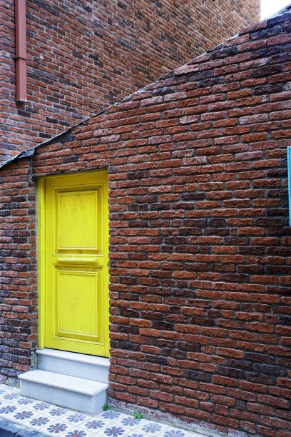 istock back door and red brick wall 1184410488