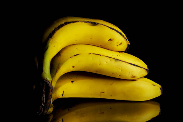 istock Platanos de Canarias on black background with reflection 1184410647