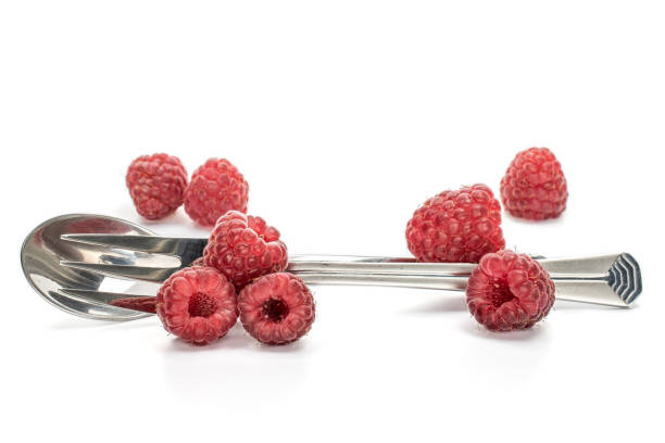 Fresh crimson raspberry isolated on white