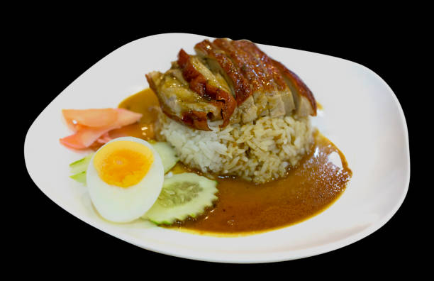 istock Roasted duck topping on thai rice, Roasted bbq duck with gravy sauce, focus selective. 1184411392