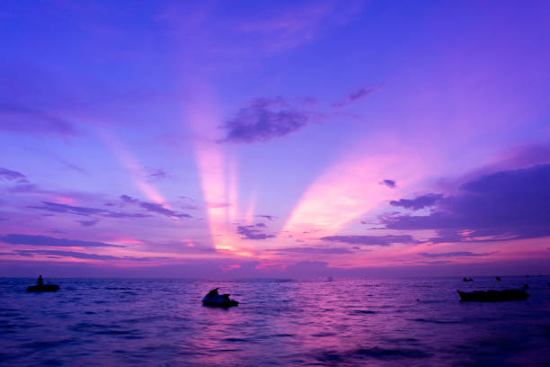 Twilight golden sunset beach Thailand Nature in twilight period which including of sunrise over the sea and the nice beach  with blue water,  blur banaboat and jetski
