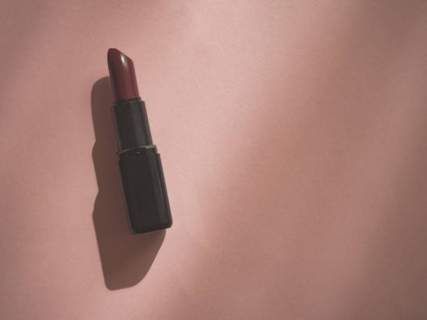 istock Woman lipstick on pink background with copy space 1184414213