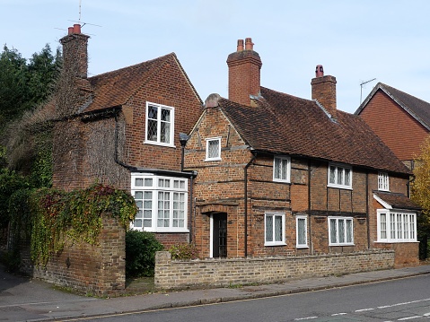 Aerial view of pitched tiled roof of detached house in West Sussex, UK