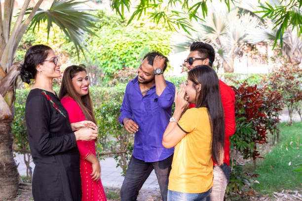 istock Young friends talking and laughing 1184415718