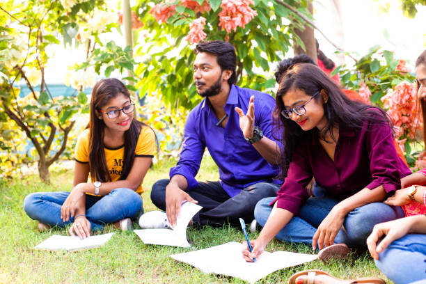 istock Group of College Student studying in a city park 1184416123