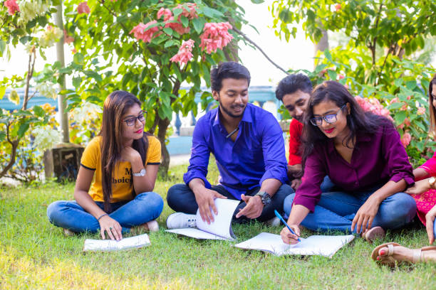 istock Group of College Student studying in a city park 1184416199