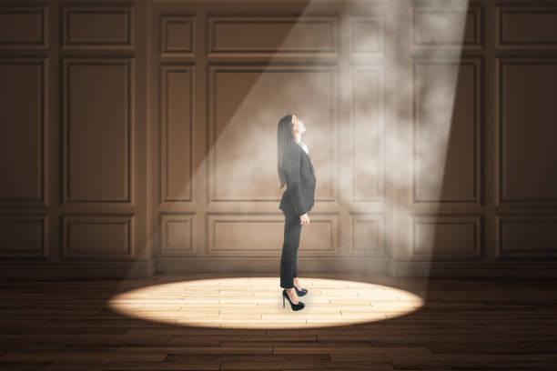 istock Businesswoman in spotlight 1184417533