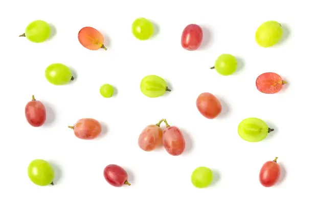 Photo of Top view of green and red grapes isolated on white background.