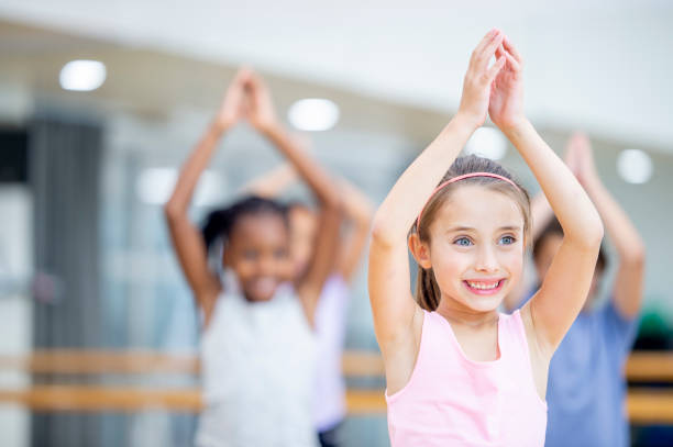 istock Multi-Ethnic Elementary Student Yoga Class stock photo 1184418204
