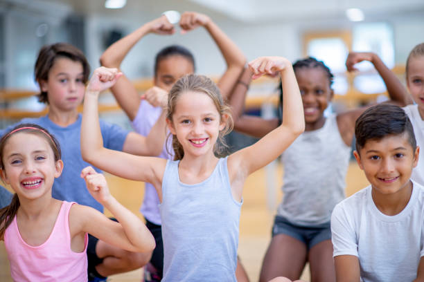 istock Strong Elementary Kids in Gym Class stock photo 1184418213
