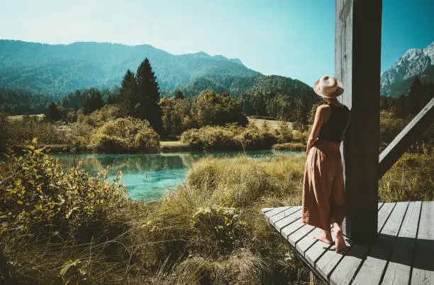 Photo of Woman enjoying freedom on nature outdoors. Travel Slovenia Europe.