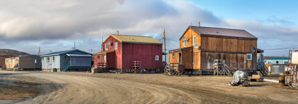 Panoramic view of residential houses in Clyde River, Nunavut, Canada. Clyde River, Baffin Island, Canada - August 20th, 2019: Panoramic view of residential houses in Clyde River, Nunavut, Canada. clyde river stock pictures, royalty-free photos & images