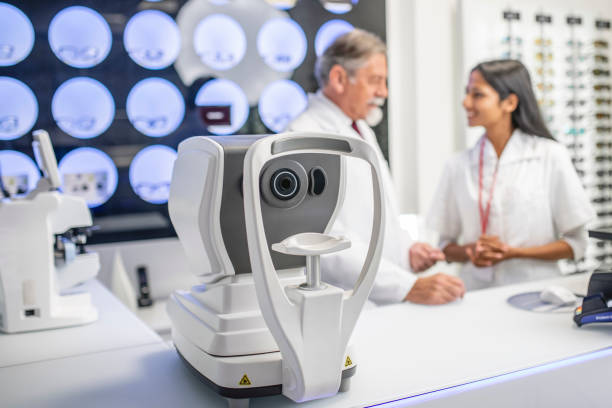 istock Two optometrists talking at an eye exam clinic 1184419819