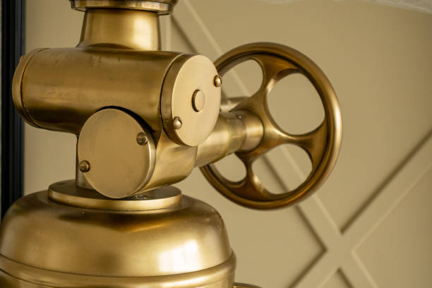 istock Brass assembly from a vintage lantern with adjustable wheel. Creative element of the loft interior. 1184420149