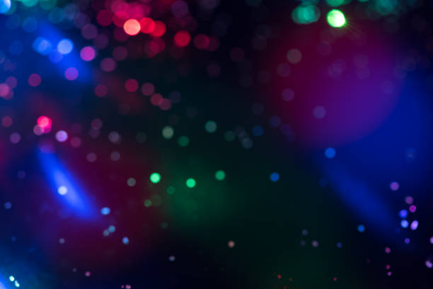 istock glitter bokeh lighting effect Colorfull Blurred abstract background for birthday, anniversary, wedding, new year eve or Christmas 1184421341