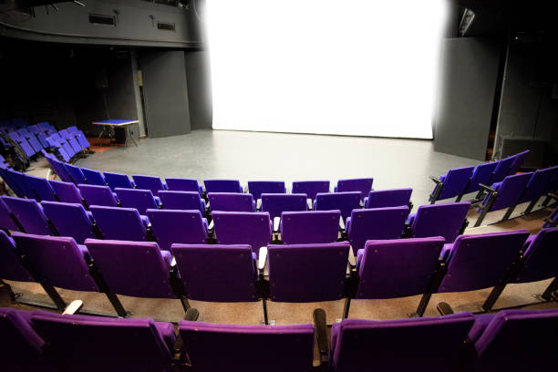 istock Open purple theatre stage curtains 1184421343