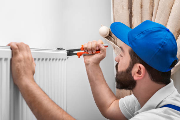 istock Installing Room Heater on the Wall 1184421380