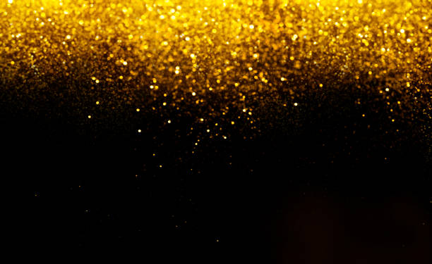 istock golden glitter bokeh lighting texture Blurred abstract background for birthday, anniversary, wedding, new year eve or Christmas 1184421385