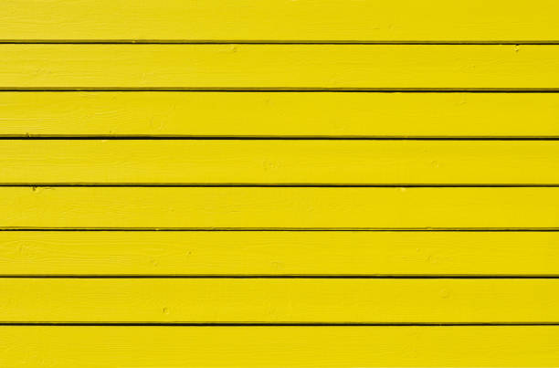 istock yellow painted wood background 1184422444