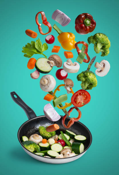 istock grilled fresh vegetables flying isolated on blue background 1184422566