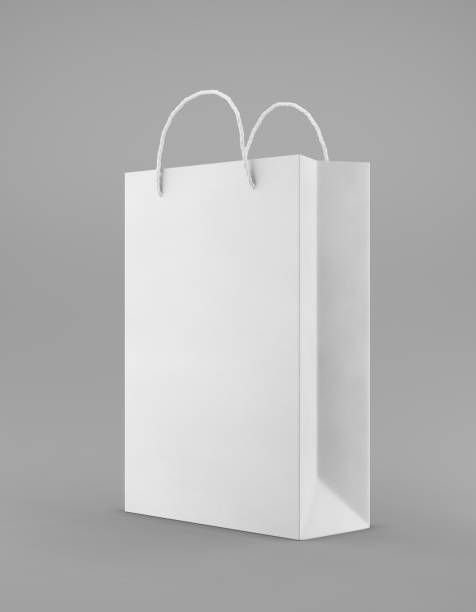 istock Eco packaging mockup bag kraft paper with handle half side. Standard medium white template on gray background promotional advertising. 3D rendering 1184423142