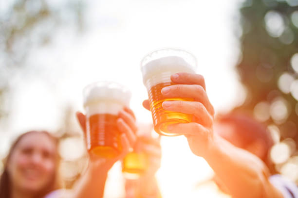 istock Friends enjoying drinking beer in the backyard. 1184424311