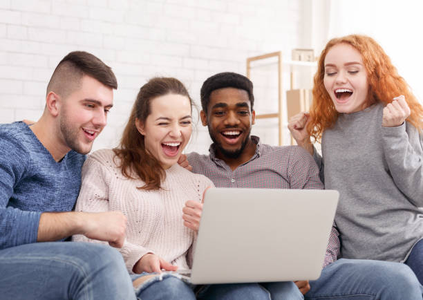 istock Best friends watching funny content on laptop 1184424567