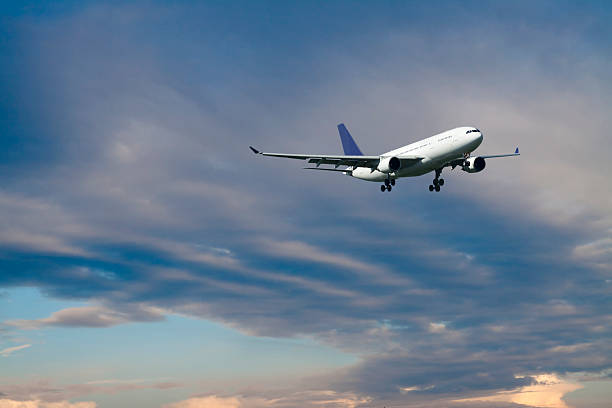 istock Airplanes Flying in a Blue Cloudy Sky, Front View 118442477