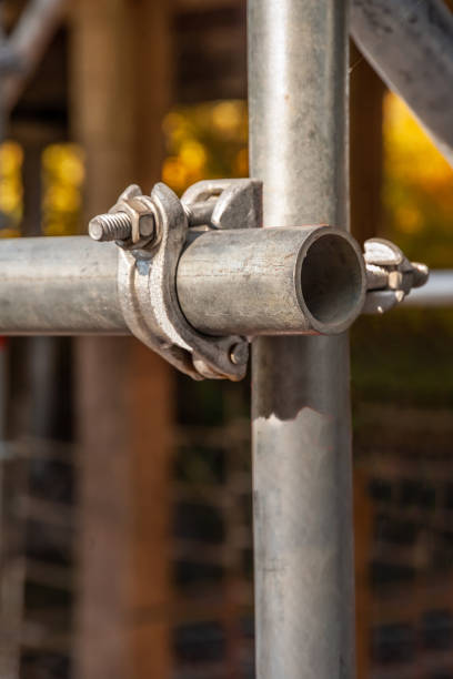 istock Clamp fastens two scaffolding pipes 1184425093