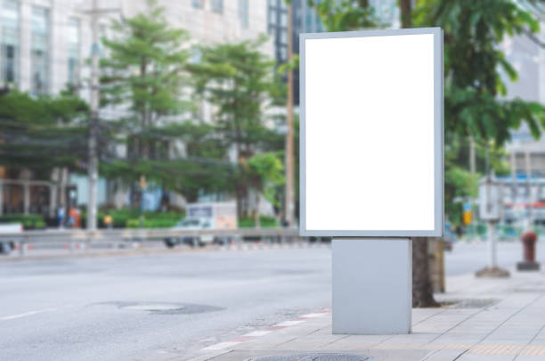 istock led blank billboard white screen side road in city. ad mockup copy space for advertising banner near bus stop in metropolis. 1184426721