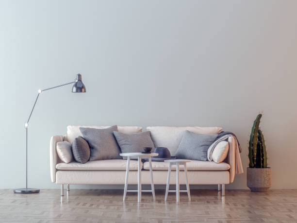 istock White sofa in a empty room with lamp 1184428618