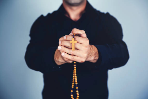 istock Prayer man hand cross 1184431316