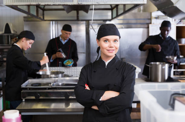 istock Confident young woman chef 1184435379