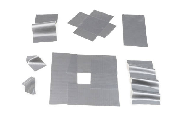 istock Silver scotch tape pieces isolated on white background. 1184436277