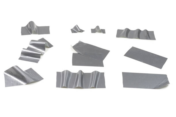 istock Silver scotch tape pieces isolated on white background. 1184436312