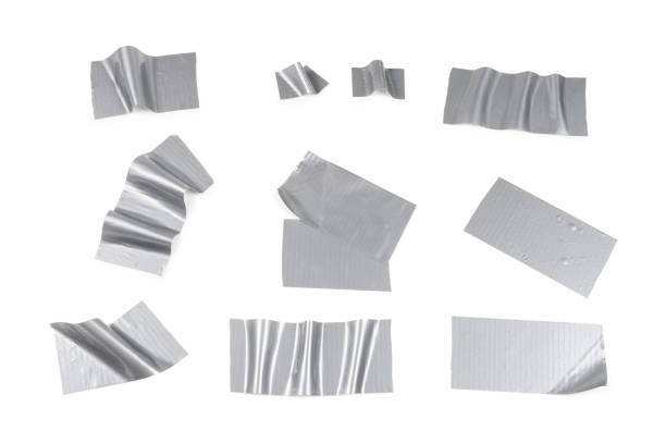 istock Silver scotch tape pieces isolated on white background. 1184436393