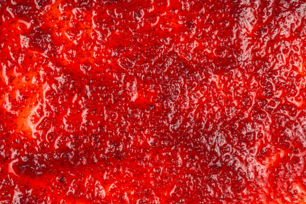 istock Red sweet jam background. Top view. 1184436395