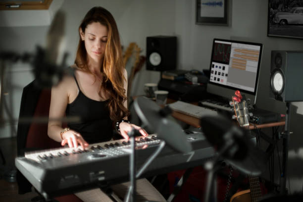 istock Music production keyboard woman 1184437497
