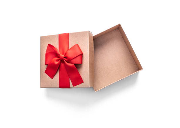 istock Golden gift box with ribbon isolated on a white. 1184444802