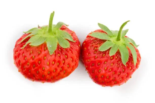 Strawberry group with slice isolated on white background.