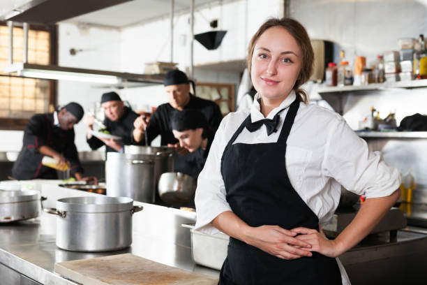 istock Professional waitress holding serving tray at restaurant kitchen 1184446152
