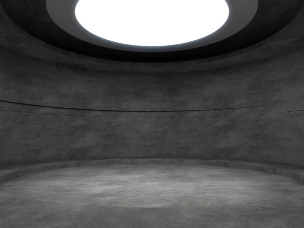 istock Pedestal for display in empty concrete room with lights from above. 3D rendering. 1184447449
