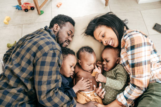 istock Family with three kids at home 1184449768